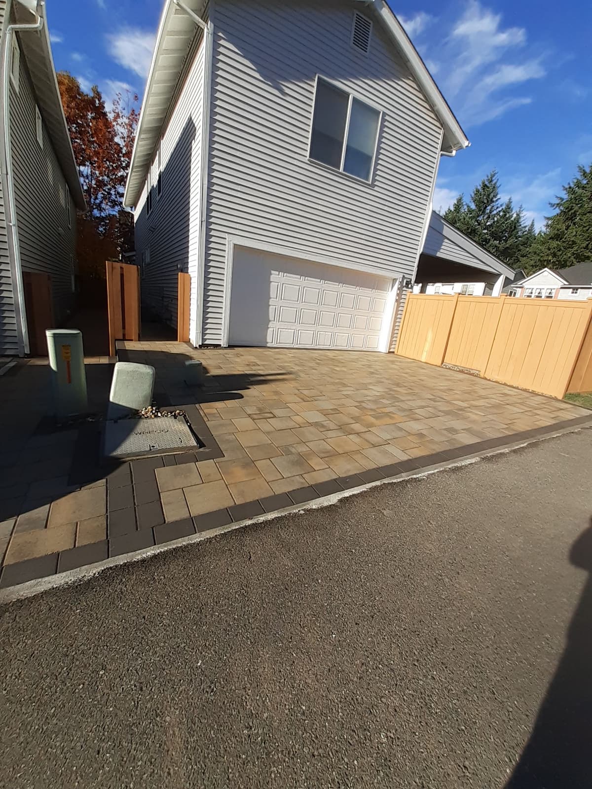Paver driveway installation in front of garage