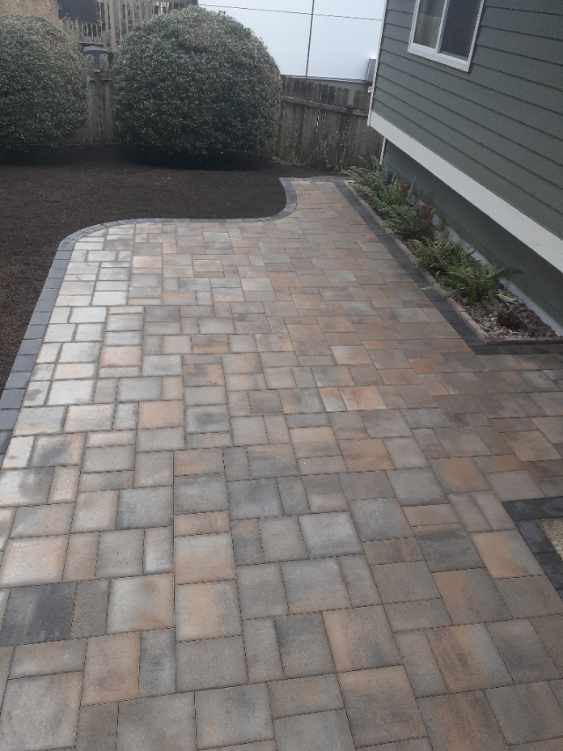 Multicolor paver walkway along side yard in Seattle area